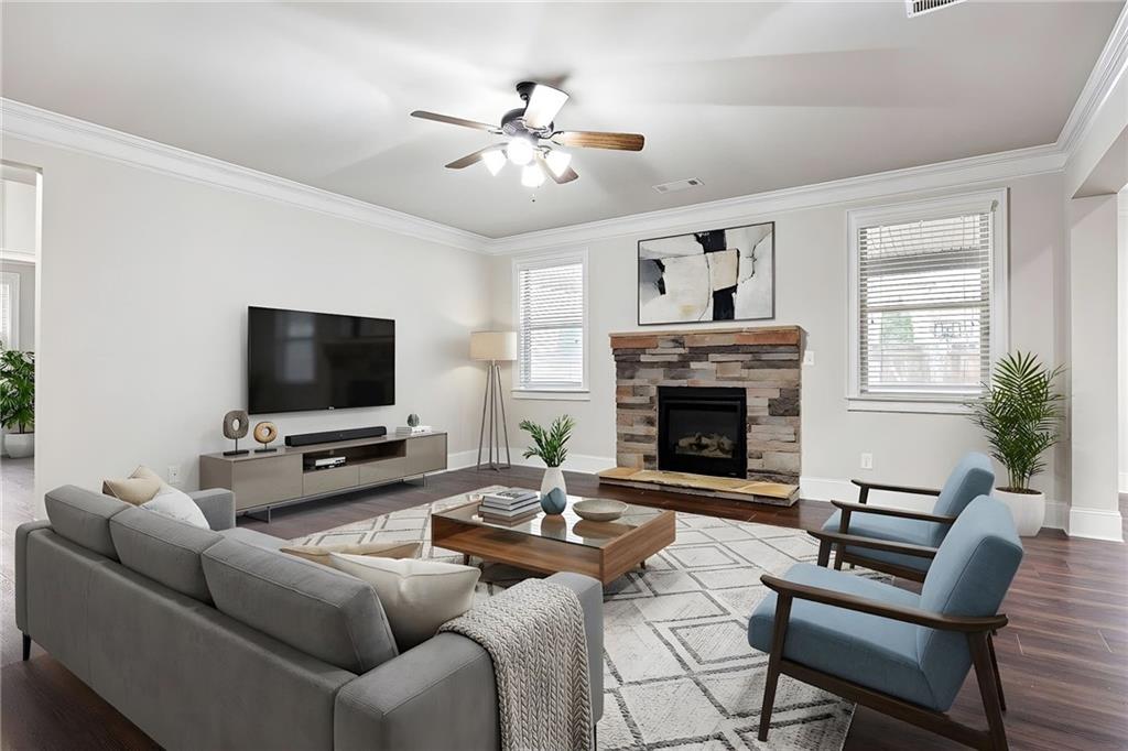 103 Gray Trail Acworth, GA 30101 - Photo 11 of 44 a living room with furniture a fireplace and a flat screen tv