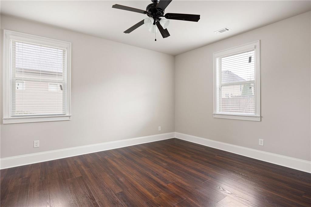 103 Gray Trail Acworth, GA 30101 - Photo 22 of 44 a view of a big room with wooden floor and windows