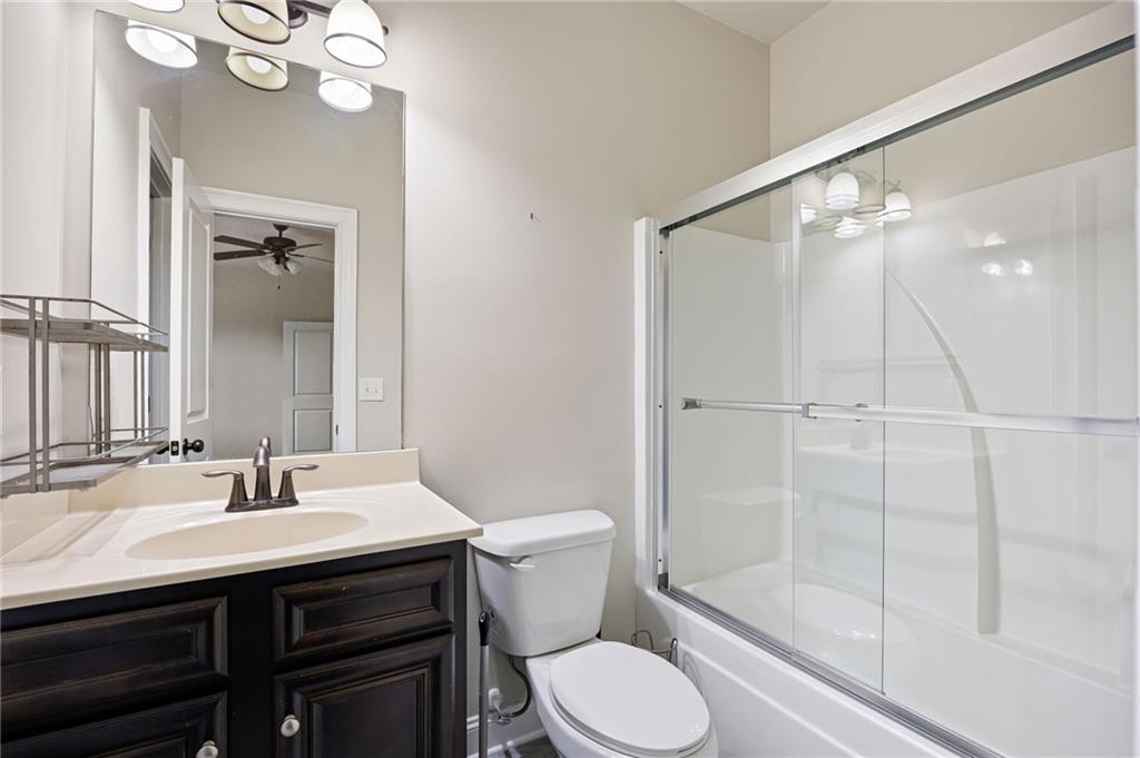 103 Gray Trail Acworth, GA 30101 - Photo 33 of 44 a bathroom with a sink a toilet and shower