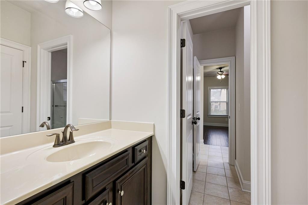103 Gray Trail Acworth, GA 30101 - Photo 35 of 44 a bathroom with a sink and a mirror