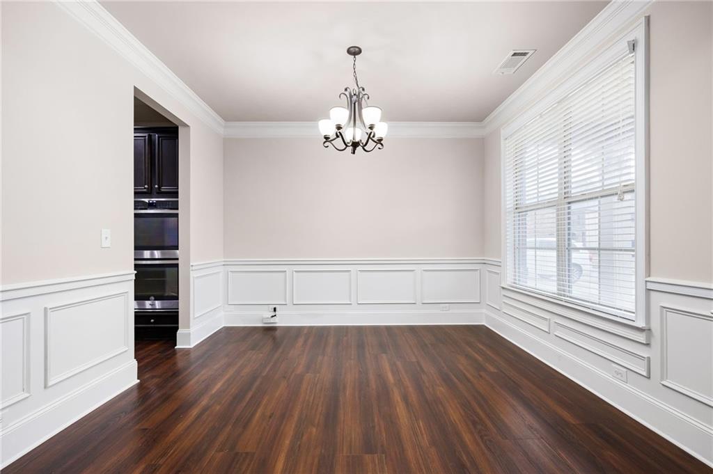 103 Gray Trail Acworth, GA 30101 - Photo 9 of 44 wooden floor in an empty room with a window