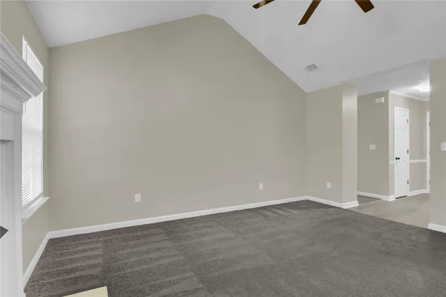 an empty room with a empty space and a window