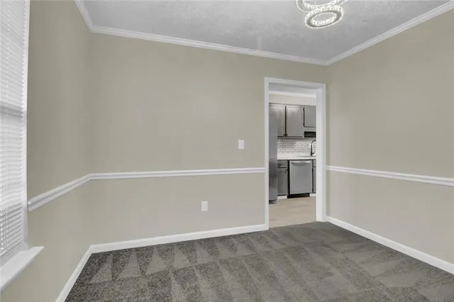 a view of an empty room with closet