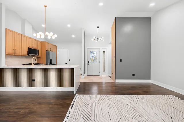 a view of a kitchen from the hallway