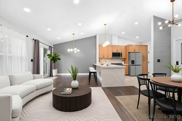 a living room with kitchen island furniture and a dining table with kitchen view