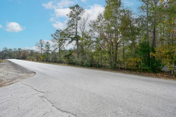 a view of a road with a yard
