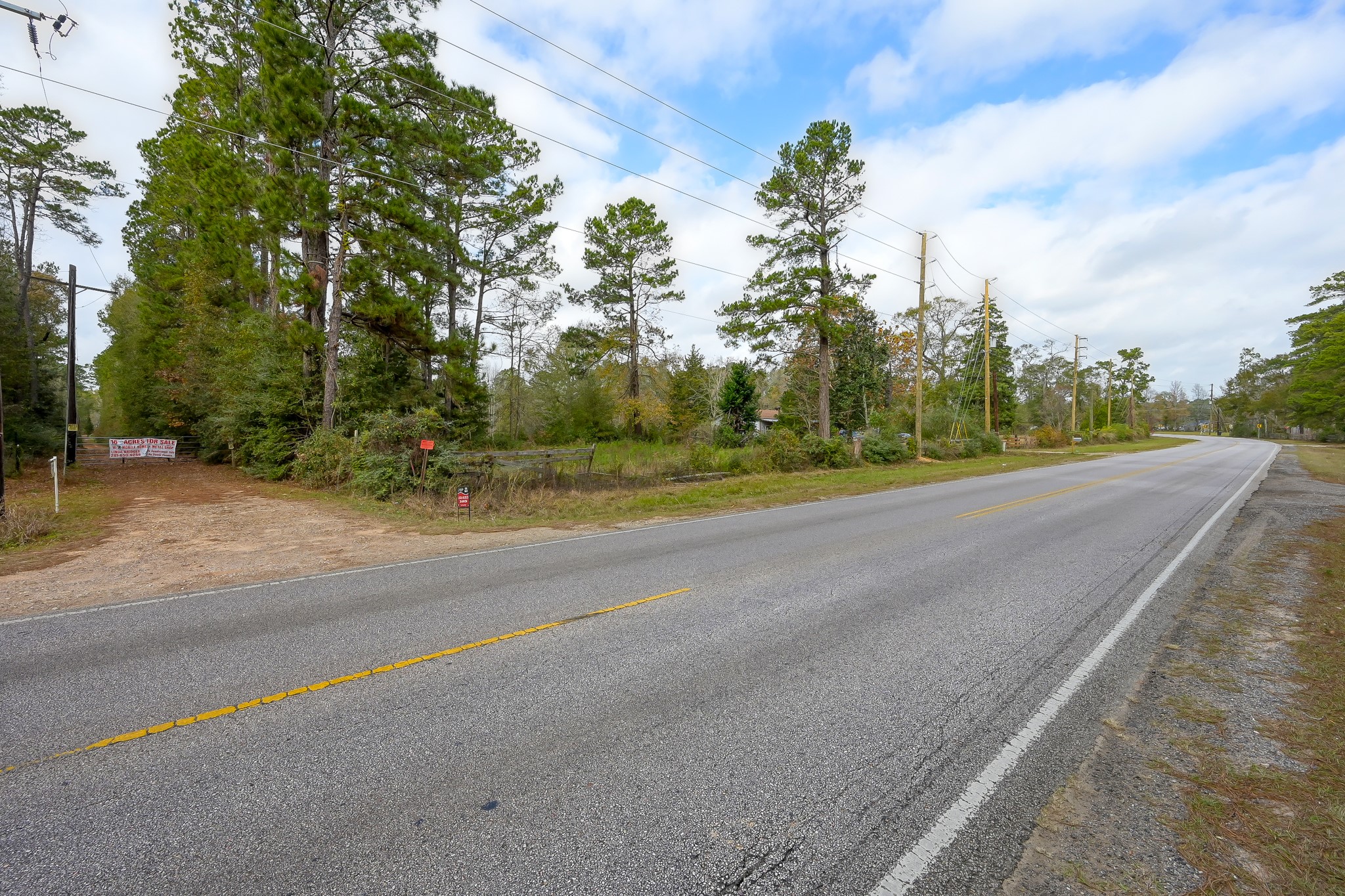 11260 Crockett Martin Road Conroe, TX 77306 - Photo 13 of 24 a view of a road with a yard