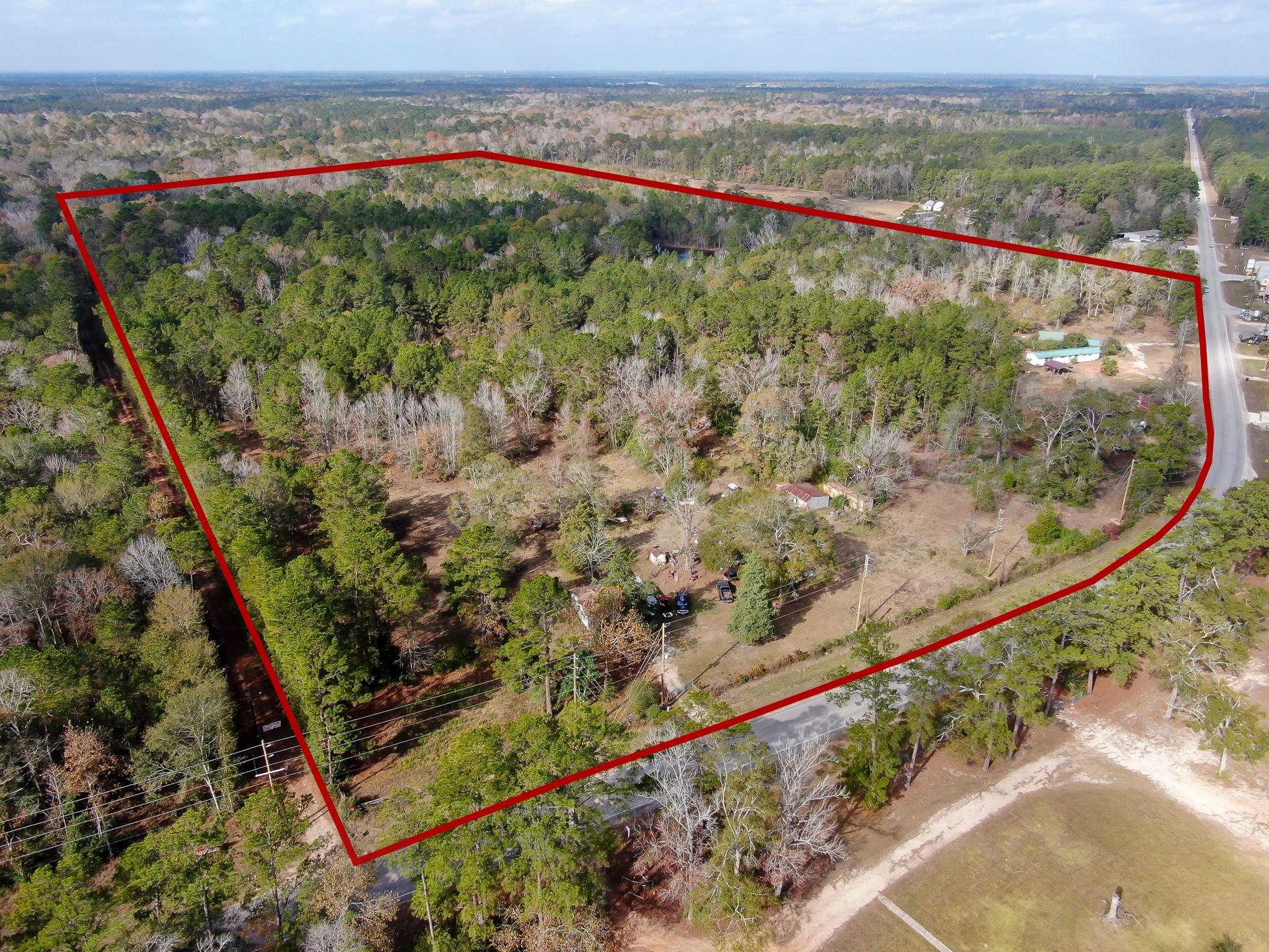 11260 Crockett Martin Road Conroe, TX 77306 - Photo 5 of 24 an aerial view of a houses with a yard and mountain