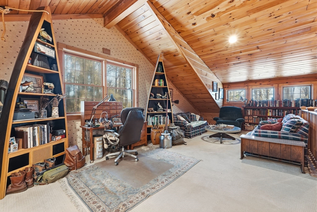 8 Ring Road Chesterfield, MA 01084 - Photo 17 of 42 a view of a livingroom with furniture and a book shelf