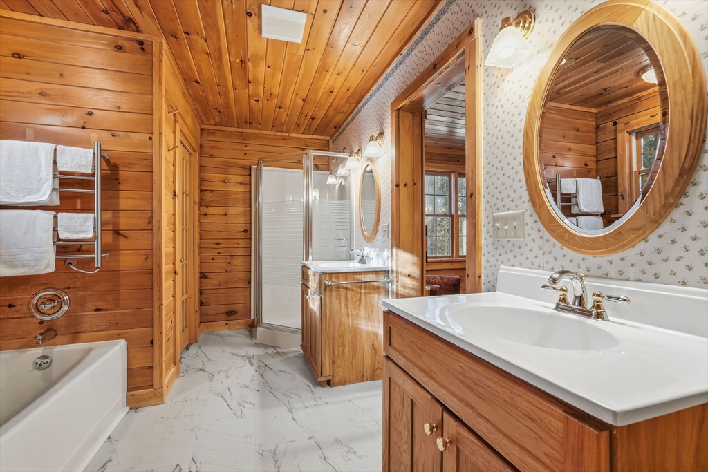 8 Ring Road Chesterfield, MA 01084 - Photo 22 of 42 a spacious bathroom with a sink double vanity mirror and a bathtub