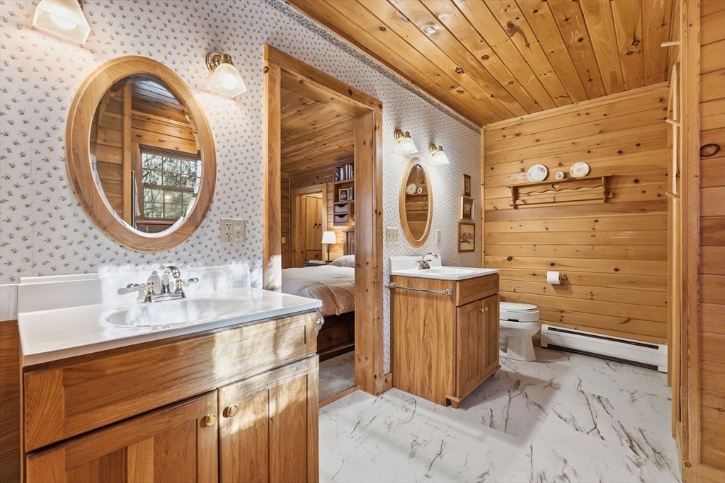8 Ring Road Chesterfield, MA 01084 - Photo 23 of 42 a bathroom with a sink a vanity and a mirror