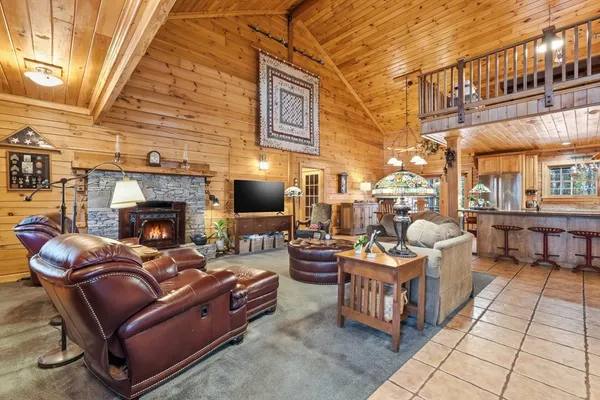 a living room with patio furniture and a potted plant