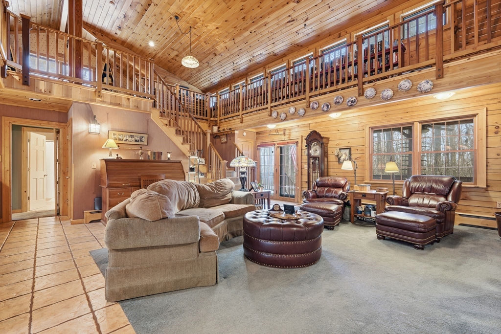 8 Ring Road Chesterfield, MA 01084 - Photo 7 of 42 a living room with patio furniture and a potted plant