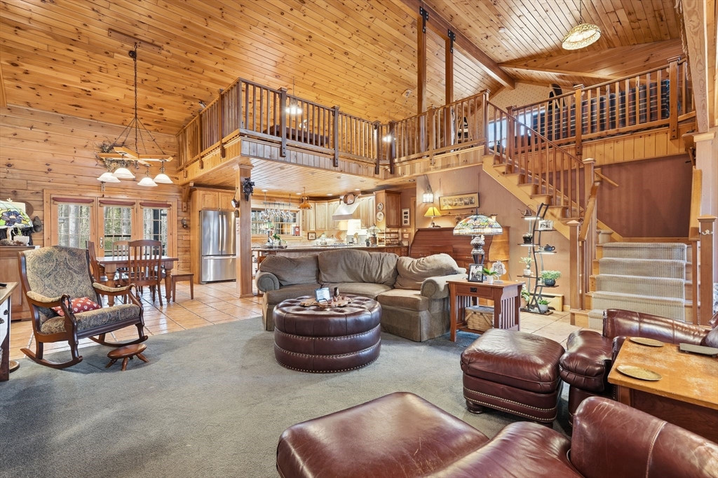 8 Ring Road Chesterfield, MA 01084 - Photo 8 of 42 a view of a patio with couches chairs and a fire pit