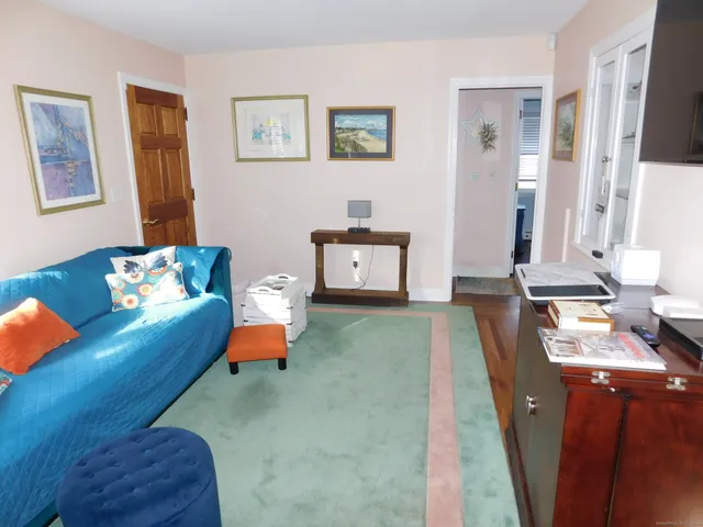 a view of a dining room with furniture and a window