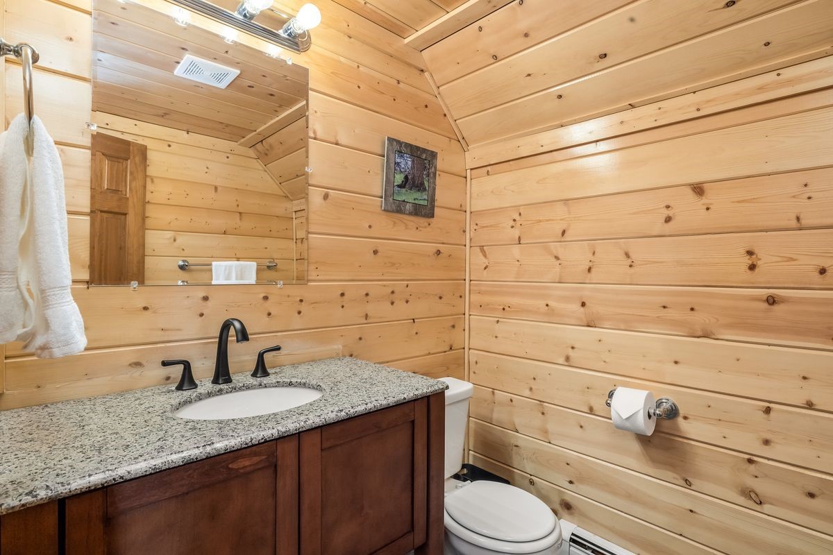 999 Bowstring Como, CO 80456 - Photo 22 of 37 a bathroom with a granite countertop toilet sink and mirror