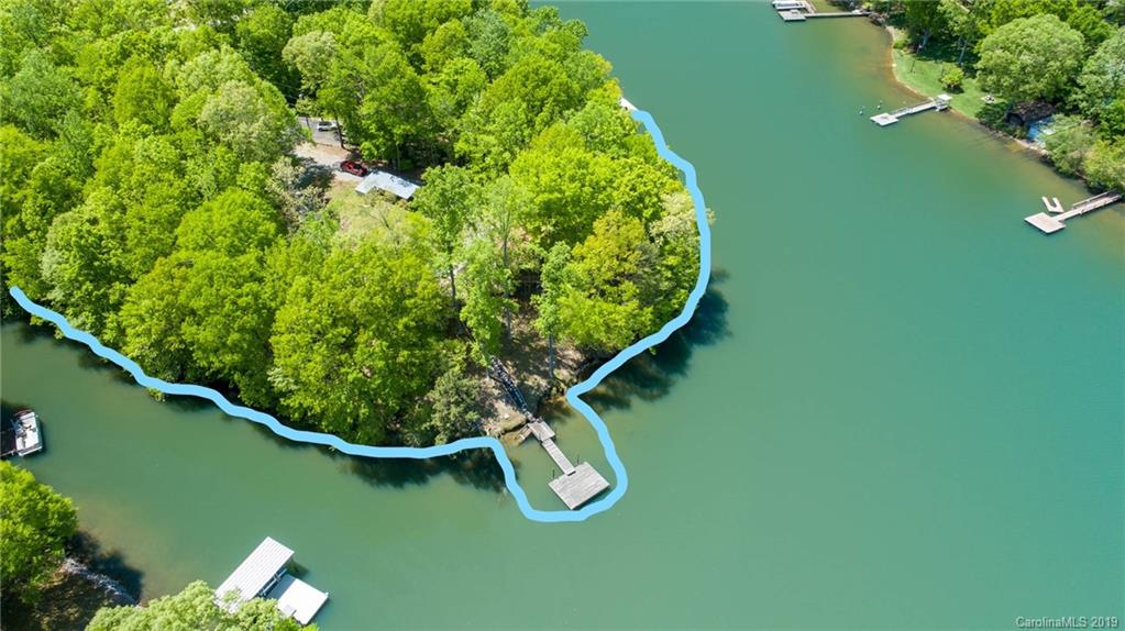 5138 Crystle Lake Road Denver, NC 28037 - Photo 2 of 41 an aerial view of a golf course with a lake