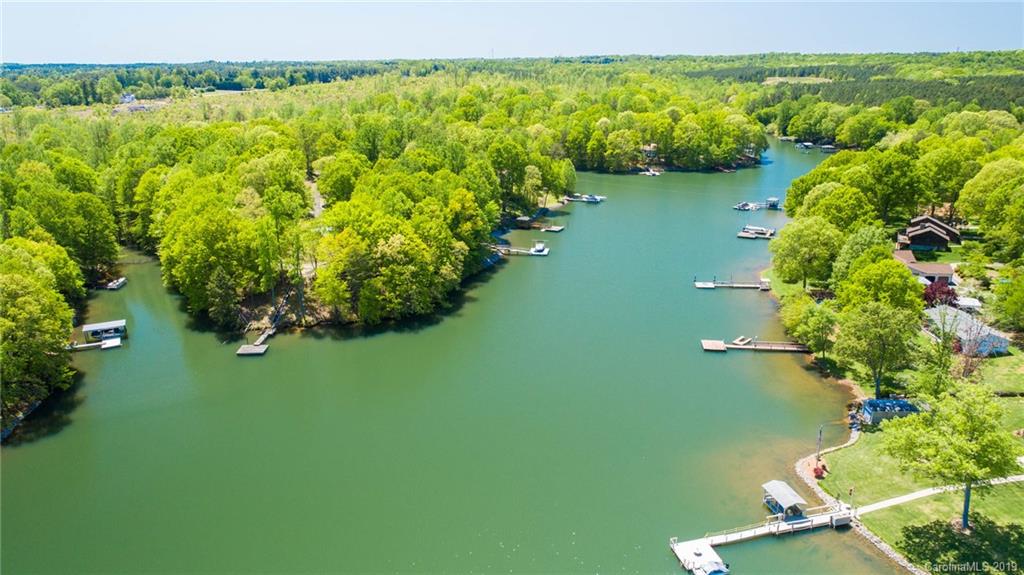 5138 Crystle Lake Road Denver, NC 28037 - Photo 19 of 41 a view of a lake with a yard