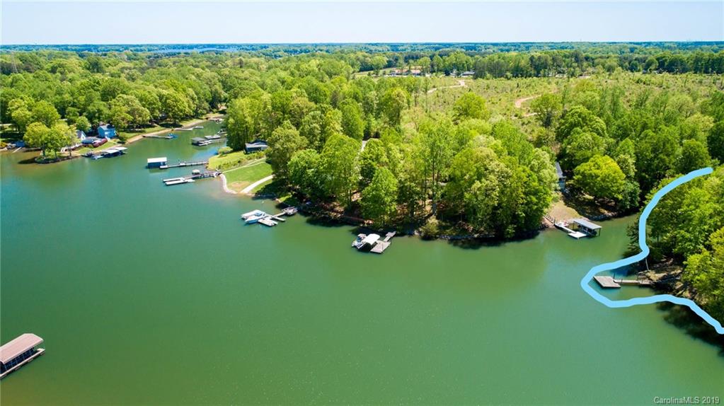 5138 Crystle Lake Road Denver, NC 28037 - Photo 21 of 41 a view of a lake with a yard