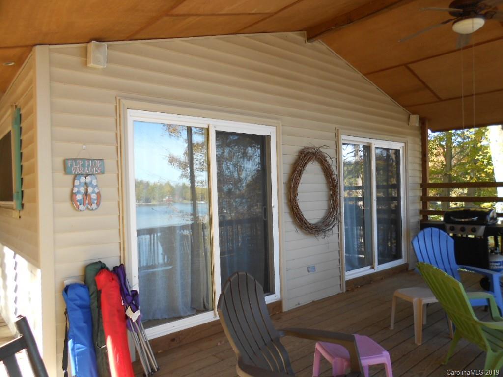 5138 Crystle Lake Road Denver, NC 28037 - Photo 23 of 41 a bedroom with furniture and a wooden floor