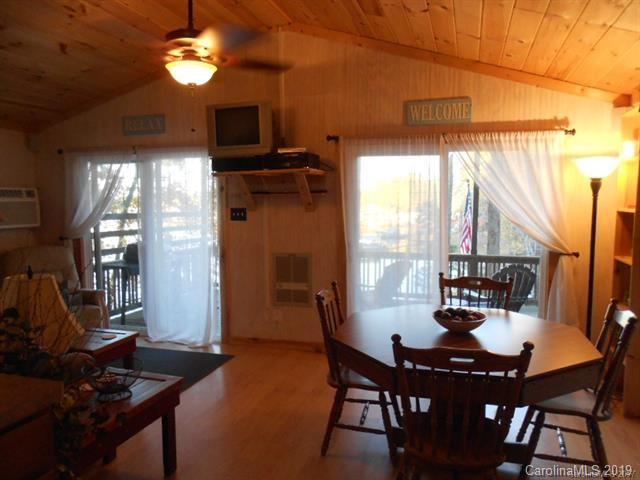 5138 Crystle Lake Road Denver, NC 28037 - Photo 25 of 41 a view of a dining room with furniture and chandelier