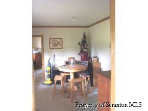 73 Baldwin Road Waymart, PA 18472 - Photo 3 of 6 a view of a dining room with furniture and wooden floor