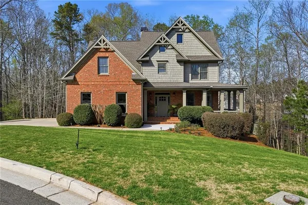 a front view of a house with a yard