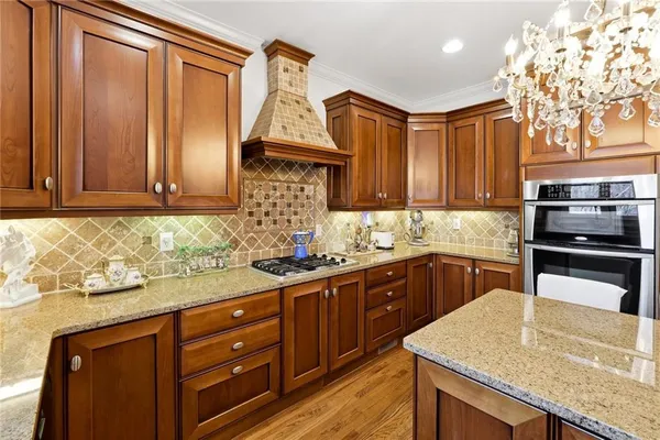 a spacious bathroom with a tub sink a mirror a shower and vanity