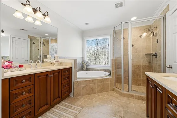 a bathroom with a granite countertop sink a toilet and a mirror