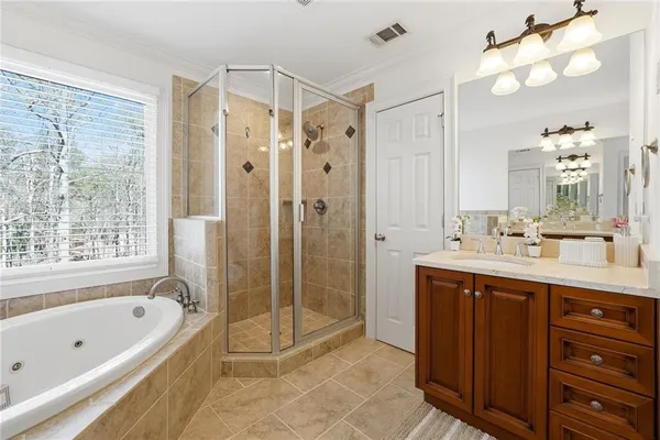 a bathroom with a sink double vanity and a shower