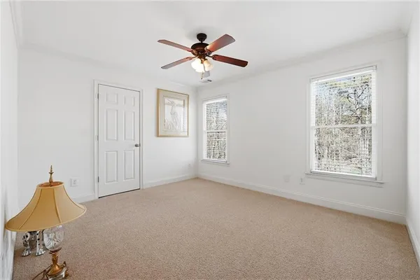 a bed room with a bed and a chandelier