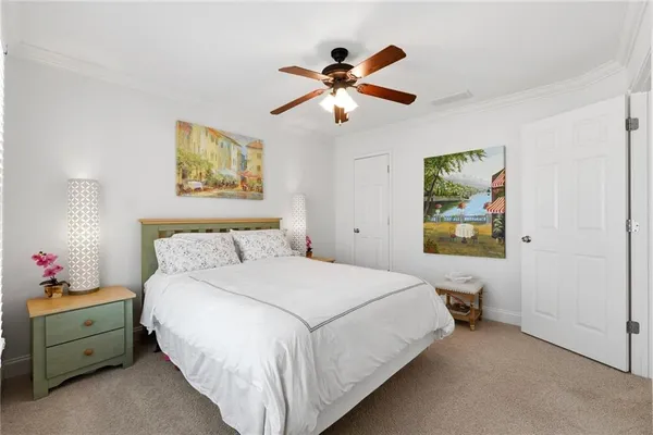 a kitchen with stainless steel appliances kitchen island granite countertop a refrigerator a stove a sink dishwasher a dining table and chairs with wooden floor