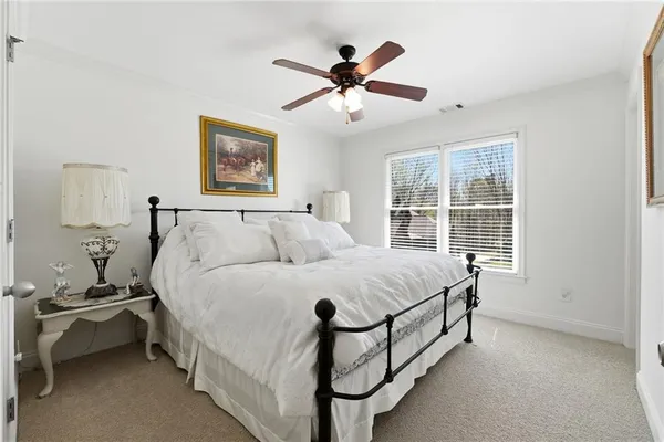 a kitchen with stainless steel appliances kitchen island granite countertop a sink a stove a dining table and chairs