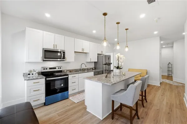an aerial view of a house with outdoor space swimming pool and mountains