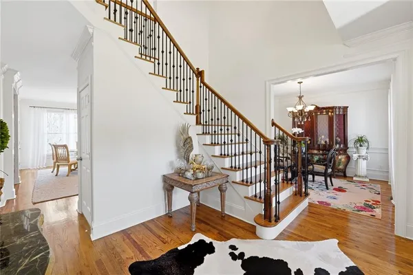a bedroom with furniture and wooden floor