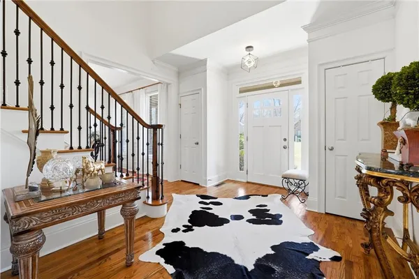 a bedroom with furniture and a chandelier