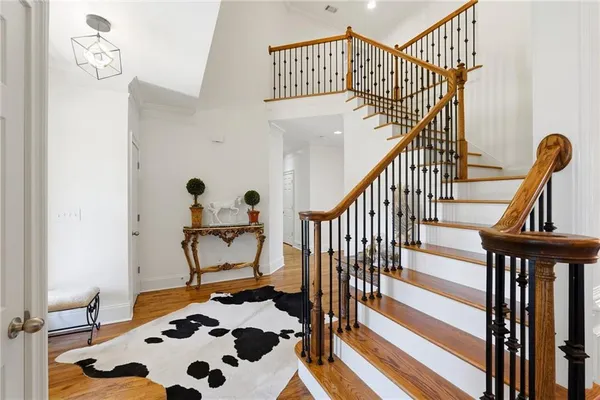 a view of a dining room with furniture and a chandelier