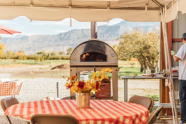 a view of a tables and chairs under an umbrella