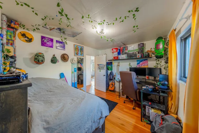 a utility room with dryer washer and a view of living room