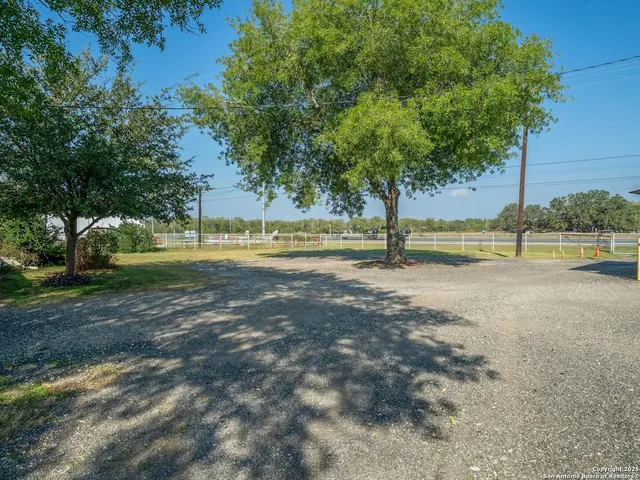 a view of a lake with outdoor seating space