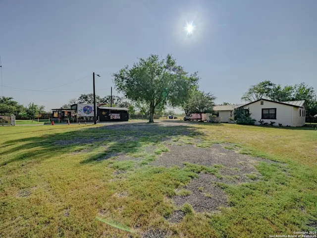 a view of a house with a big yard