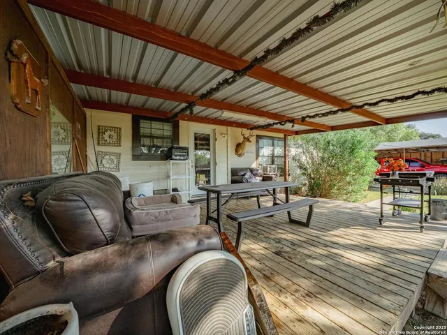 a outdoor space with patio lots of furniture and a grill
