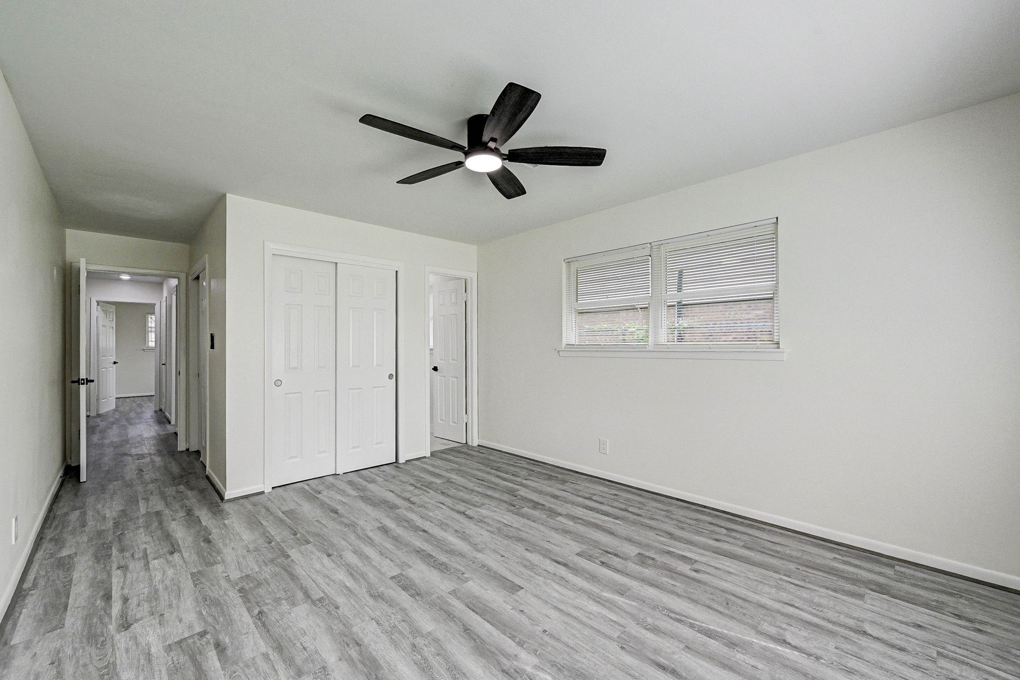 6027 Ledbetter Street Houston, TX 77087 - Photo 13 of 23 a view of empty room with wooden floor