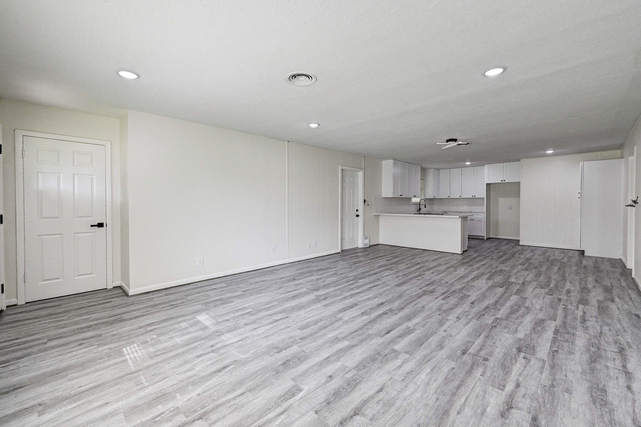 6027 Ledbetter Street Houston, TX 77087 - Photo 6 of 23 a view of kitchen and wooden floor