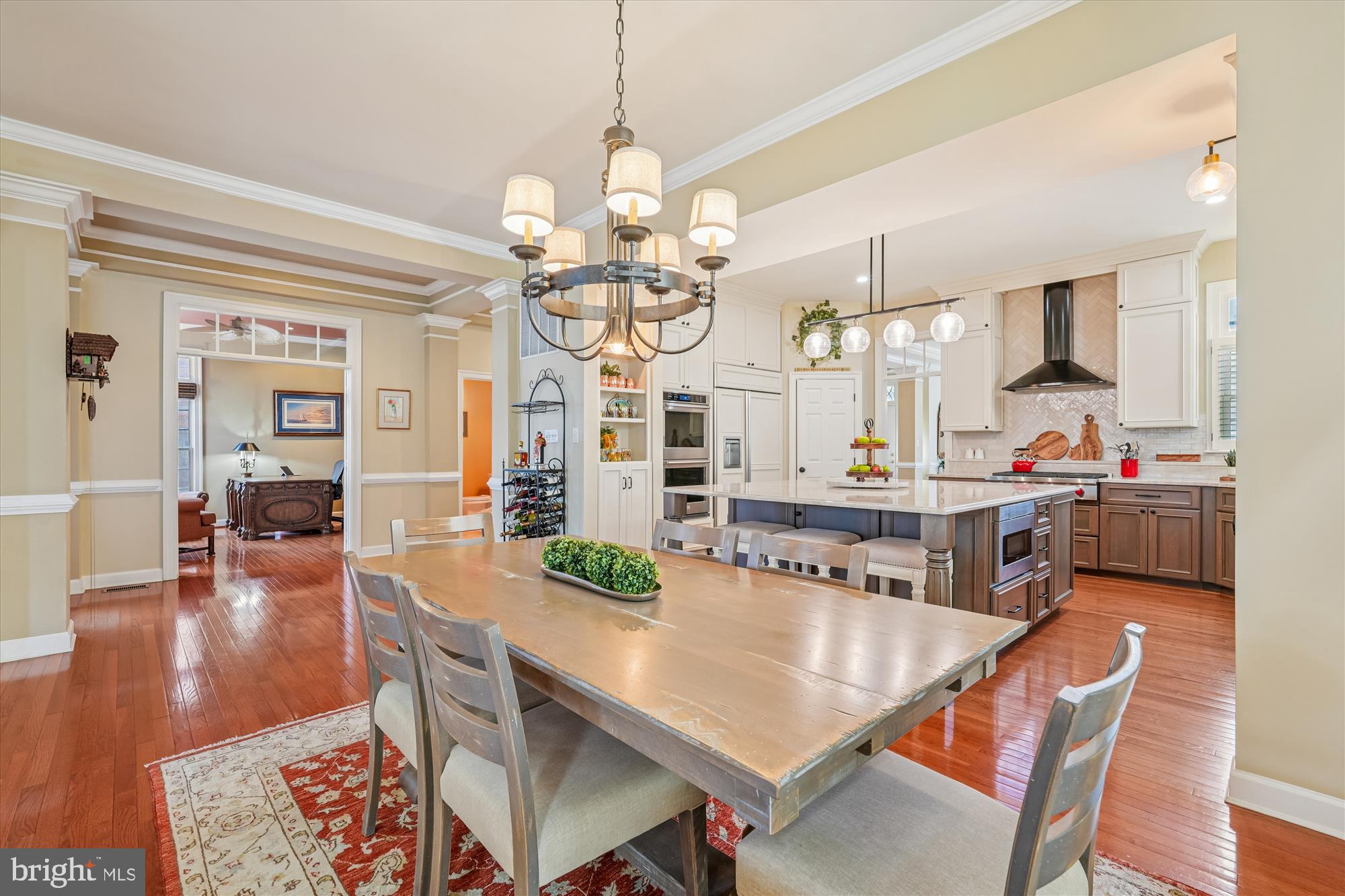 111 Lake Street Gaithersburg, MD 20878 - Photo 12 of 77 a view of a dining room and livingroom with furniture wooden floor a chandelier