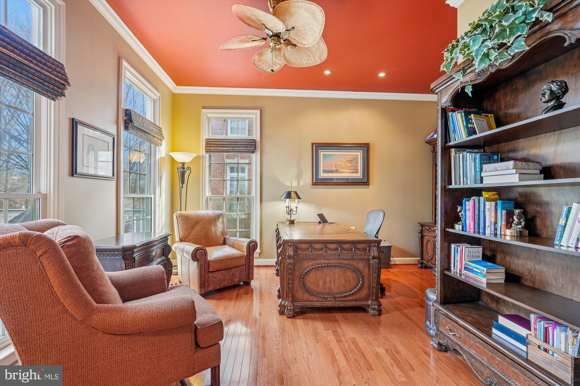 111 Lake Street Gaithersburg, MD 20878 - Photo 22 of 77 a living room with furniture a bookshelf and a book shelf