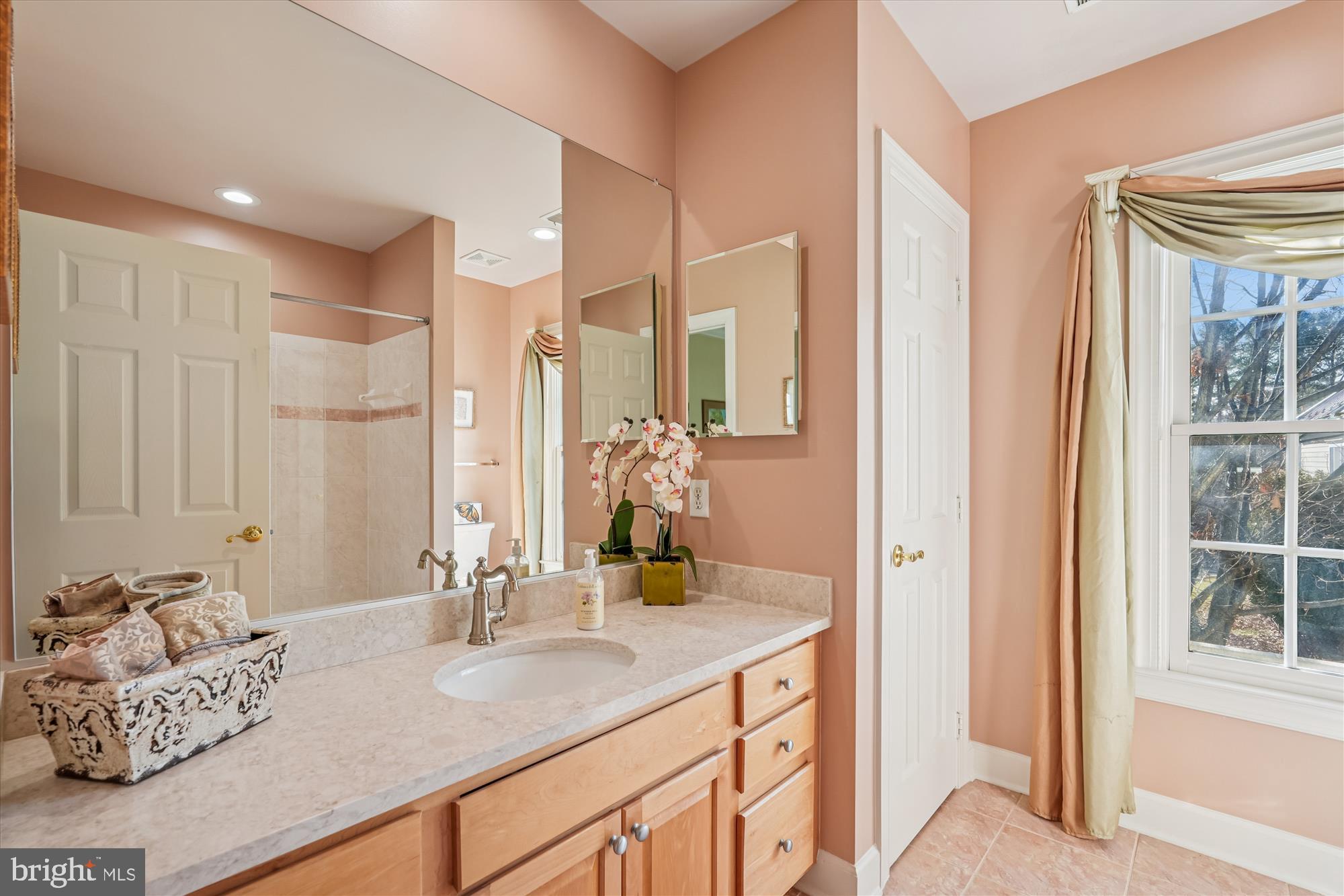 111 Lake Street Gaithersburg, MD 20878 - Photo 38 of 77 a bathroom with a double vanity sink and a mirror