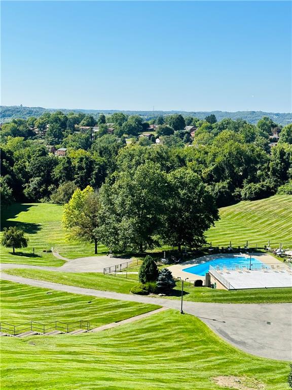 1150 Bower Hill Road, Unit 718B Mt. Lebanon, PA 15243 - Photo 20 of 21 a view of a swimming pool and a yard
