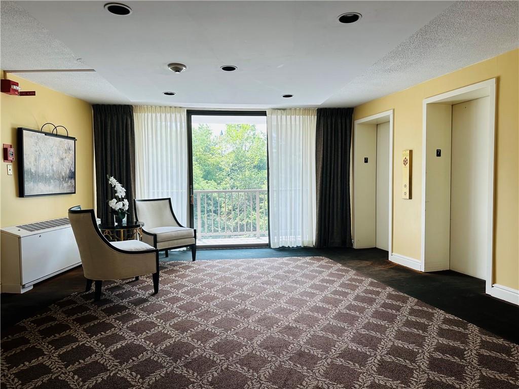 1150 Bower Hill Road, Unit 718B Mt. Lebanon, PA 15243 - Photo 5 of 21 a living room with furniture and a window