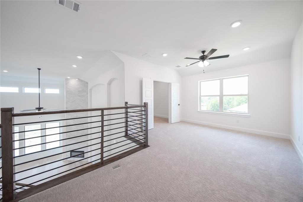 2719 Triumph Court Heath, TX 75126 - Photo 15 of 39 a view of an empty room with a window